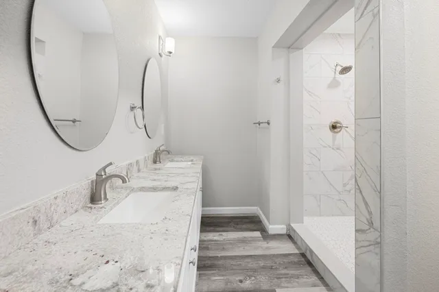 a bathroom with a toilet and shower