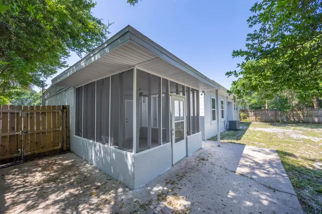 a view of backyard with swimming pool