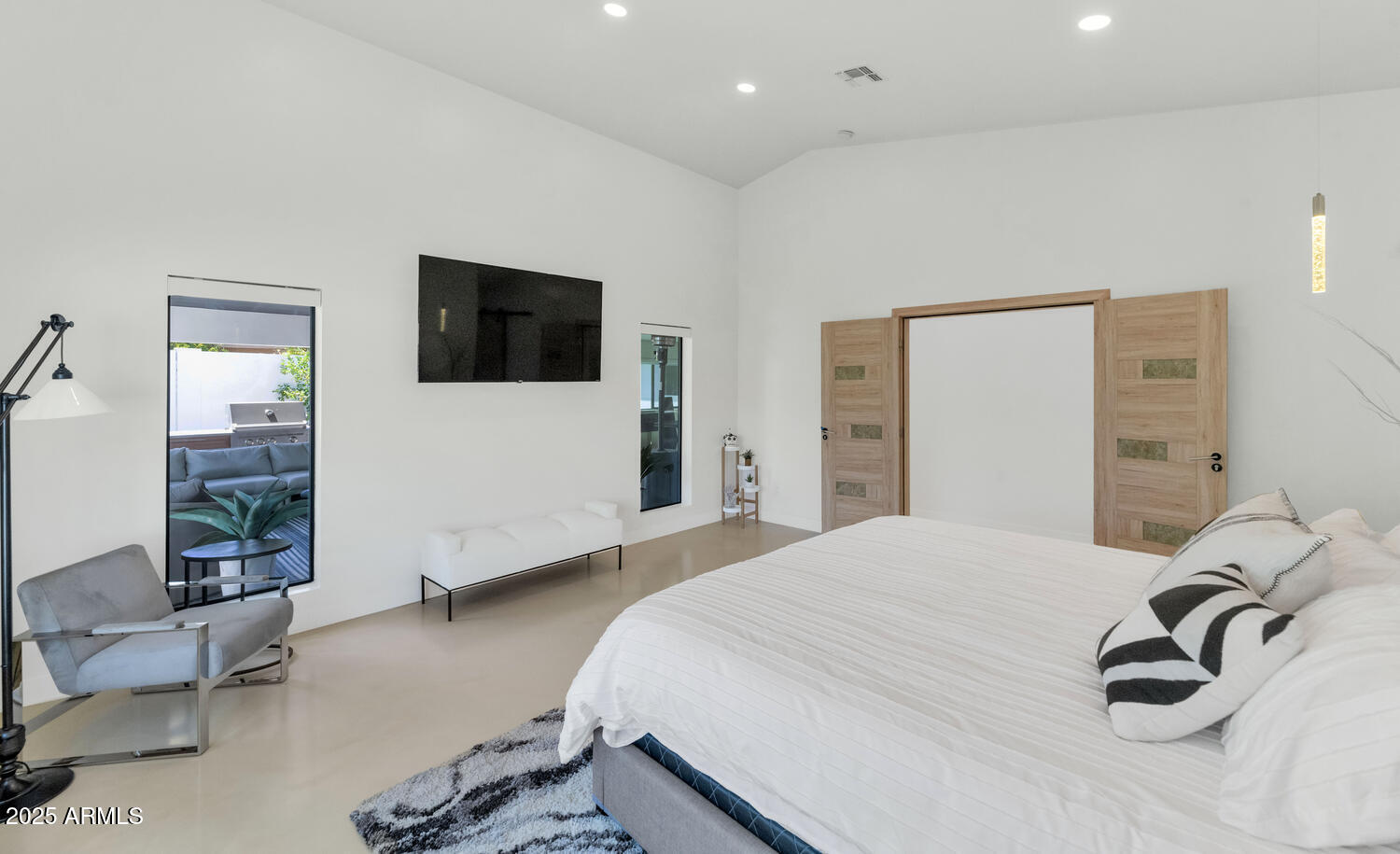 3420 East Oregon Avenue Phoenix, AZ 85018 - Photo 13 of 29 a bedroom with a bed and a flat screen tv