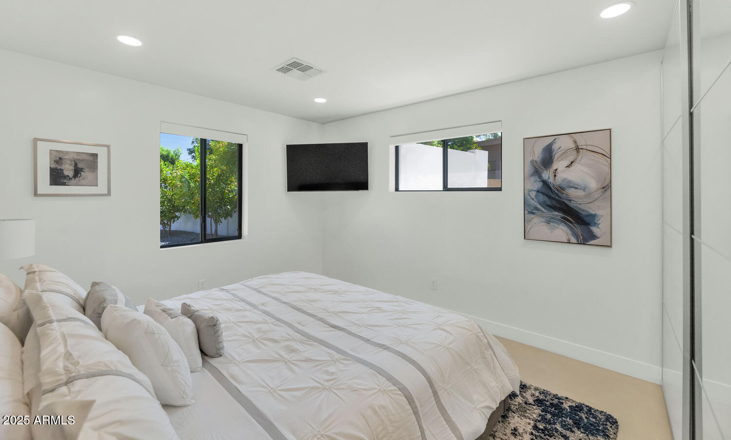 3420 East Oregon Avenue Phoenix, AZ 85018 - Photo 17 of 29 a bedroom with a bed and a window