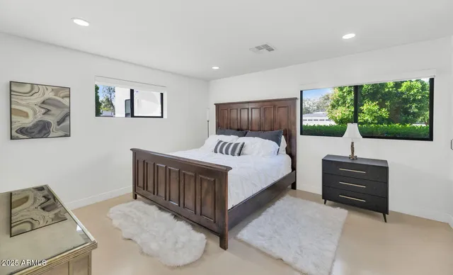 a bedroom with a bed and a view of bedroom