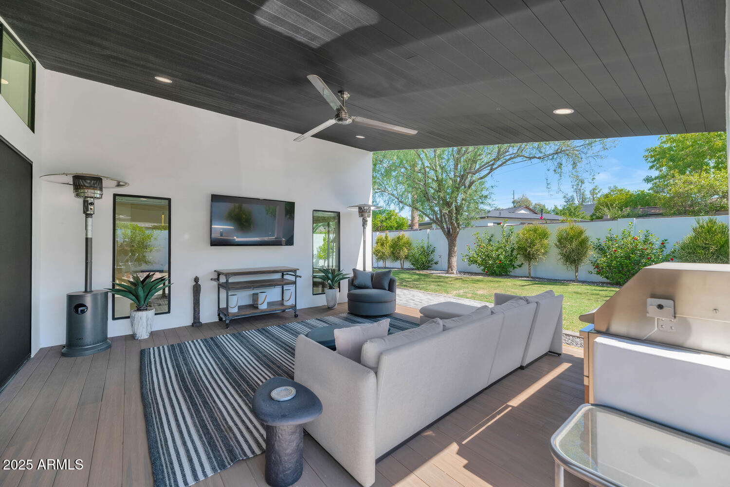 3420 East Oregon Avenue Phoenix, AZ 85018 - Photo 23 of 29 a living room with furniture and a flat screen tv