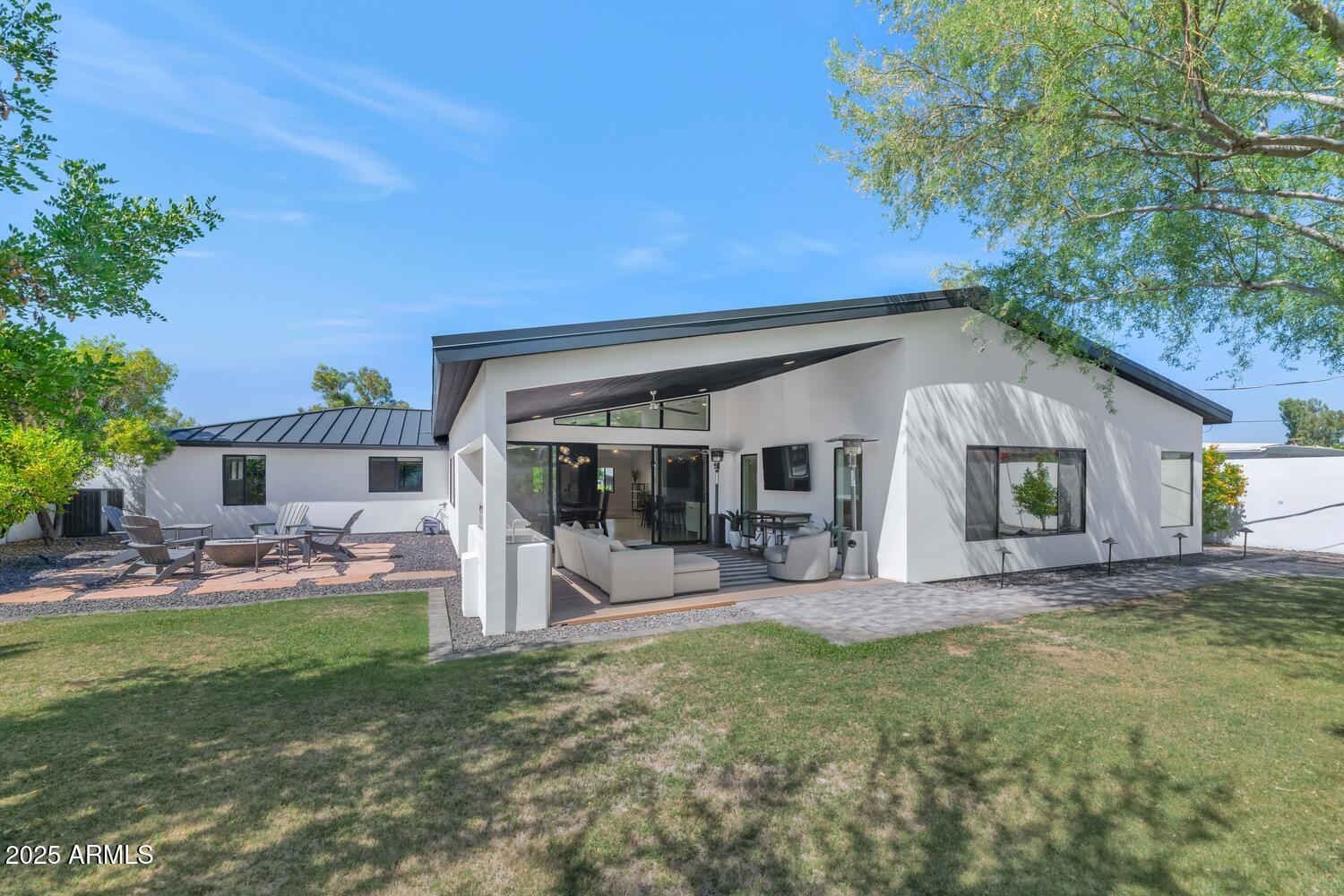 3420 East Oregon Avenue Phoenix, AZ 85018 - Photo 24 of 29 a view of a house with backyard porch and sitting area