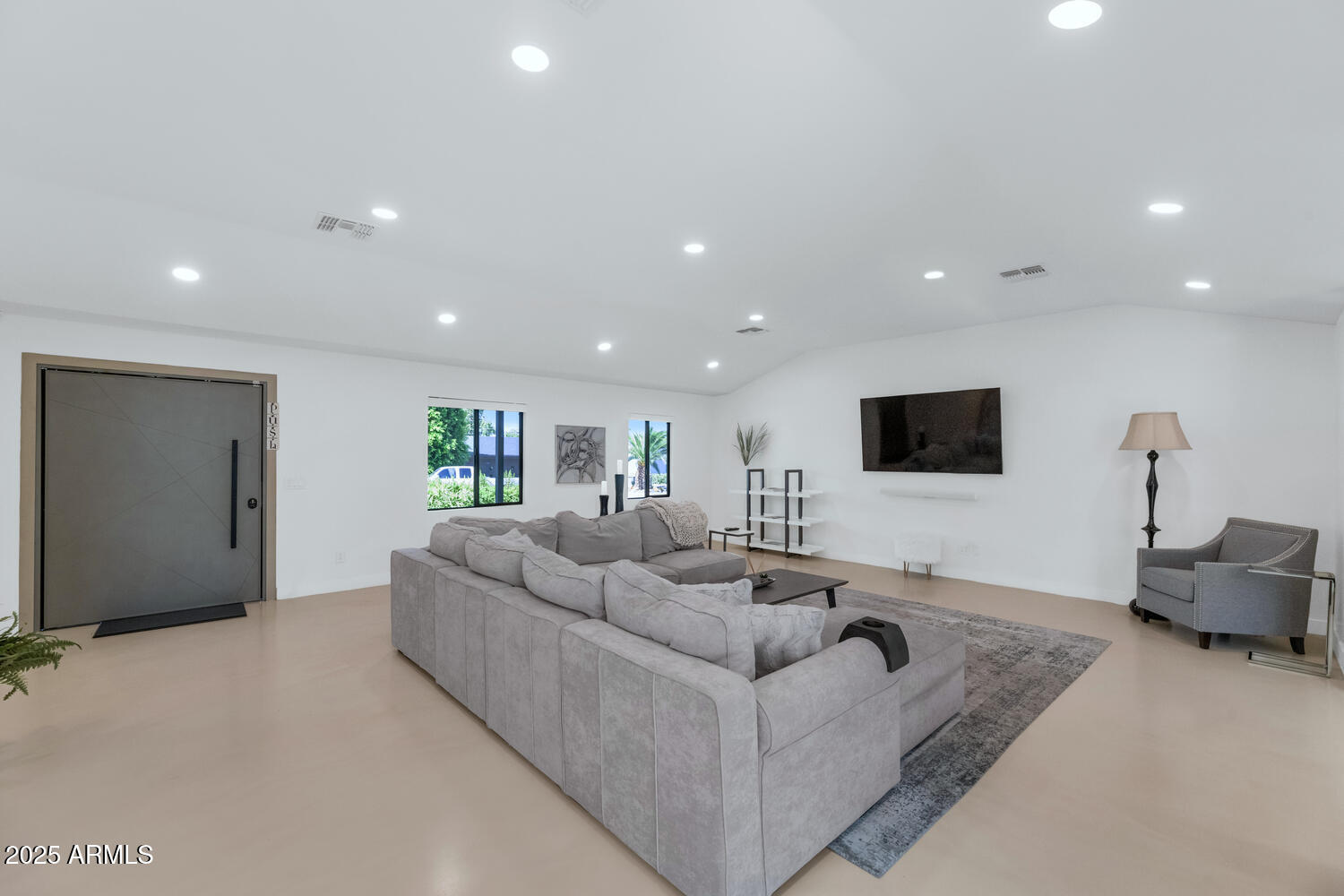 3420 East Oregon Avenue Phoenix, AZ 85018 - Photo 3 of 29 a living room with furniture and a flat screen tv