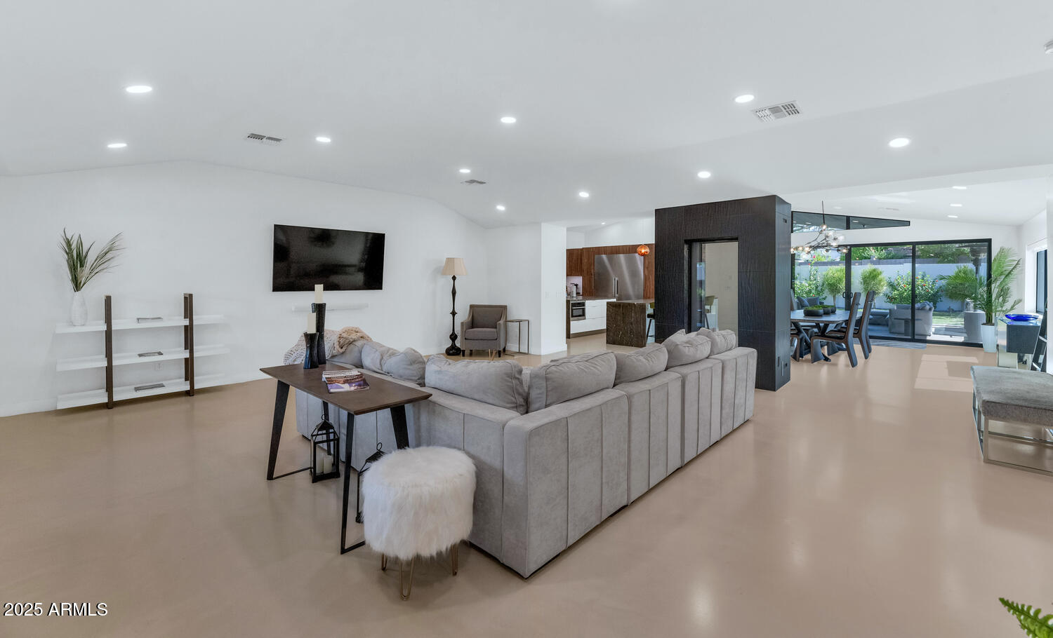 3420 East Oregon Avenue Phoenix, AZ 85018 - Photo 5 of 29 a living room with furniture and a flat screen tv