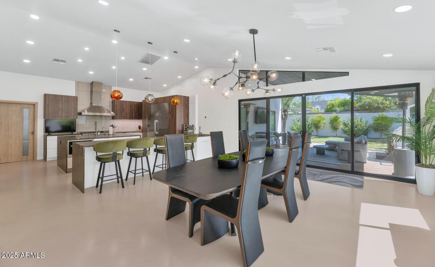 3420 East Oregon Avenue Phoenix, AZ 85018 - Photo 7 of 29 a dining room with stainless steel appliances granite countertop table chairs and a living room view