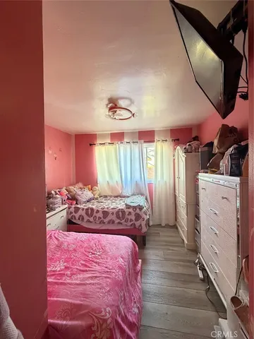 a bed room with a bed and a window