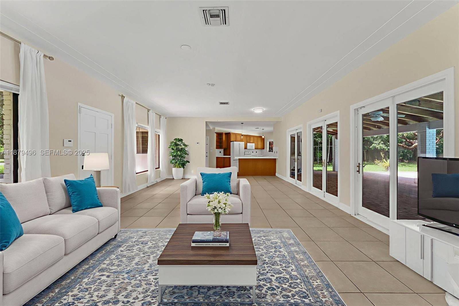 6275 Southwest 123rd Terrace Pinecrest, FL 33156 - Photo 14 of 49 a living room with furniture and a couch