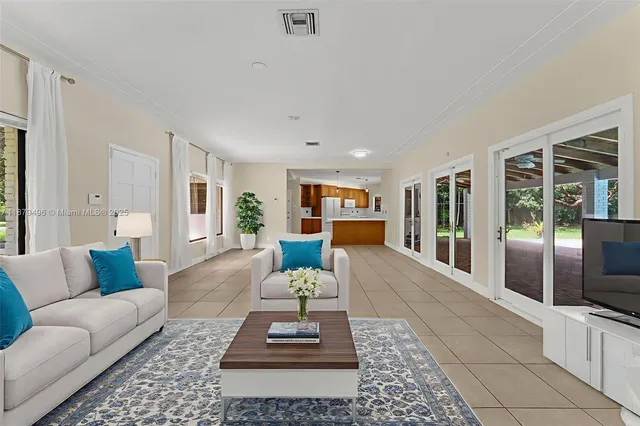 a living room with furniture and a couch