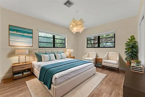 a view of a room with wooden floor and window