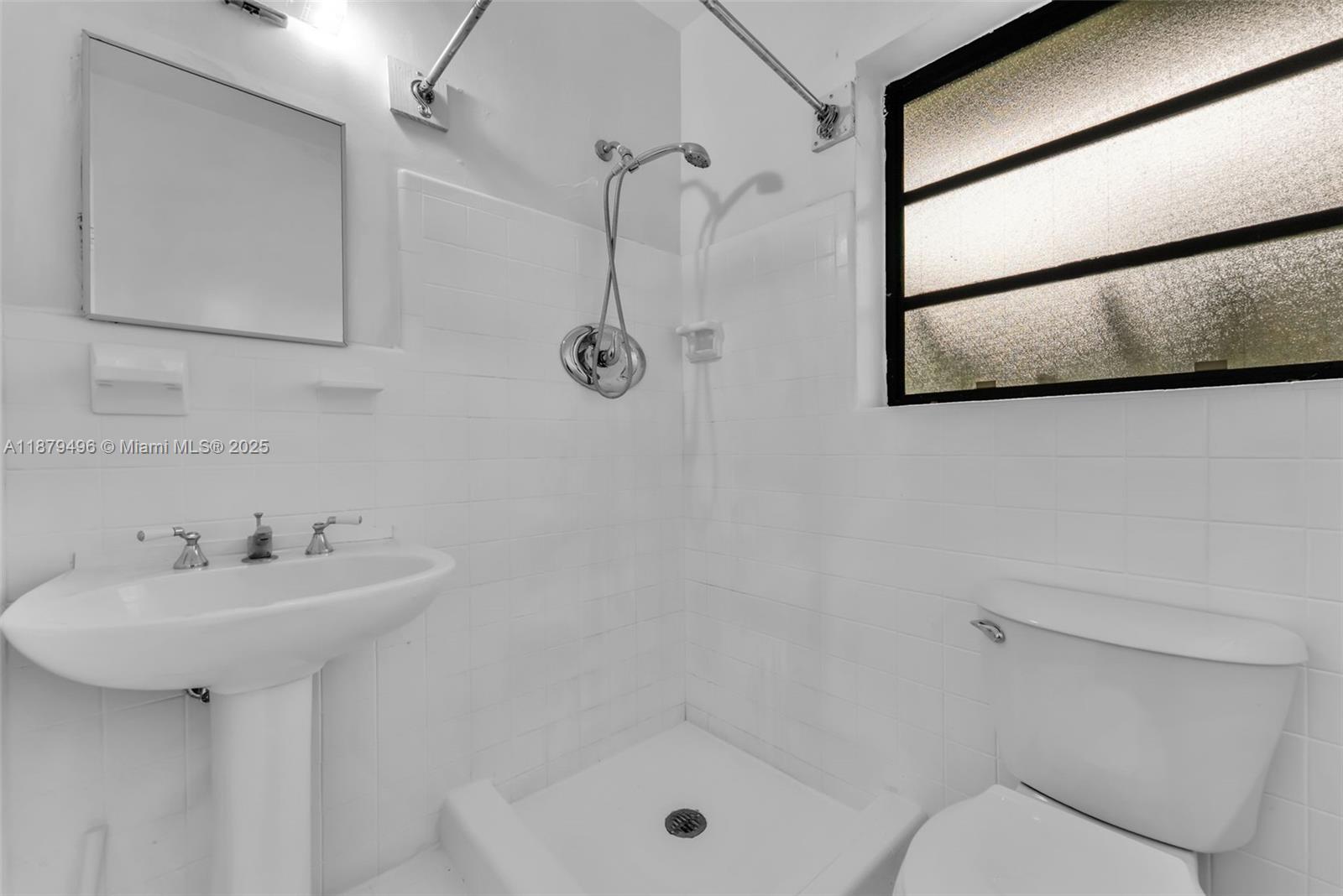 6275 Southwest 123rd Terrace Pinecrest, FL 33156 - Photo 32 of 49 a bathroom with a sink mirror toilet and shower