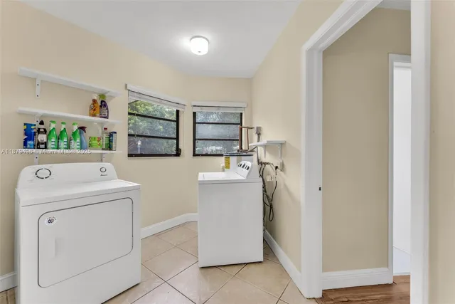 a utility room with dryer and washer