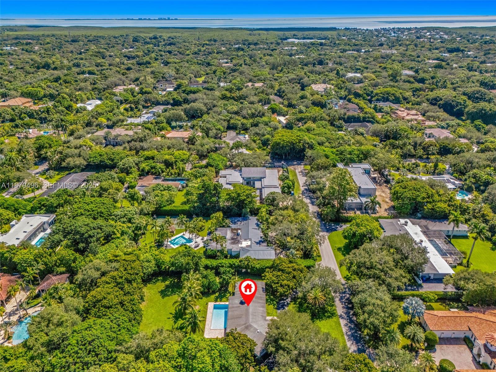 6275 Southwest 123rd Terrace Pinecrest, FL 33156 - Photo 35 of 49 an aerial view of residential houses with outdoor space and trees