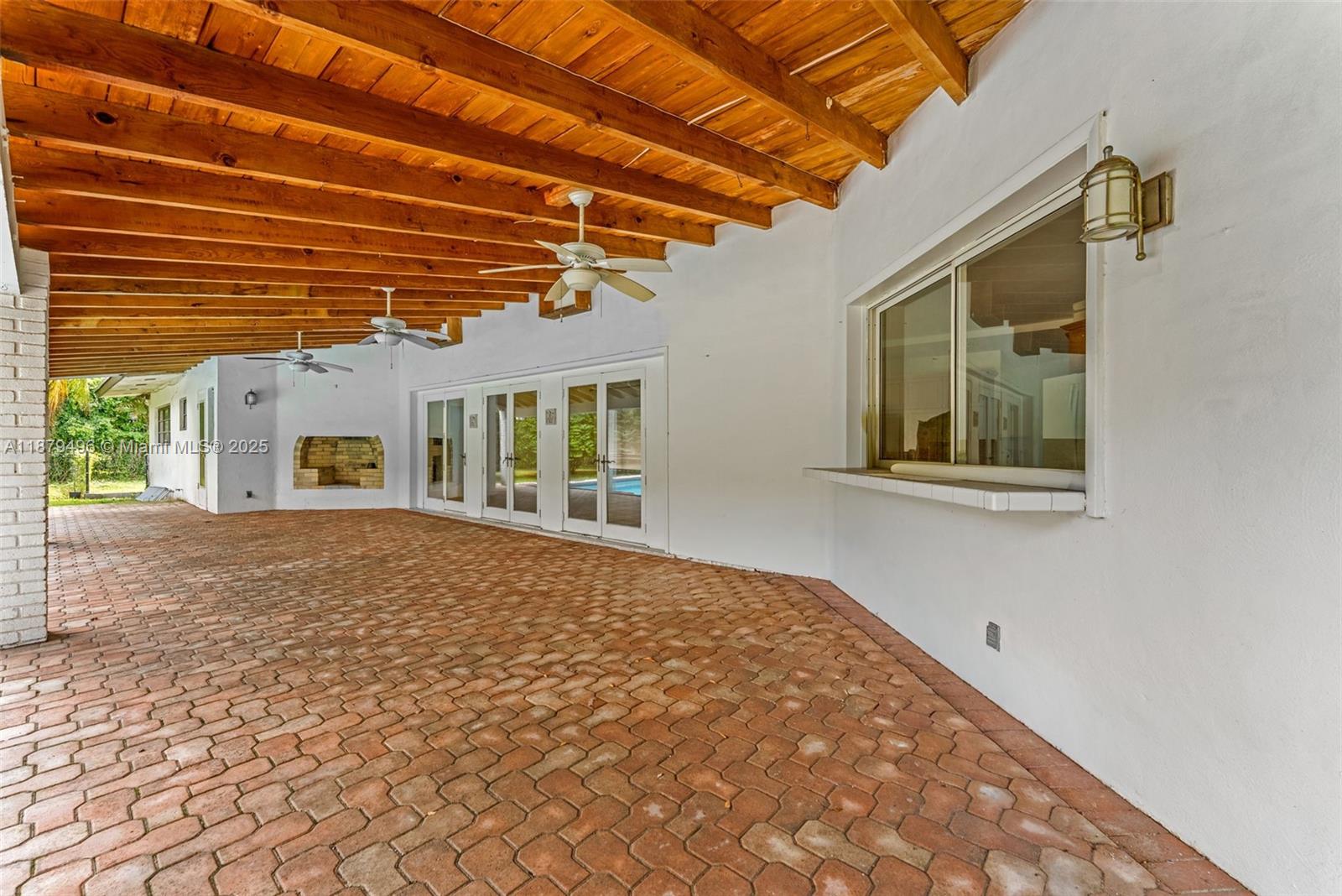 6275 Southwest 123rd Terrace Pinecrest, FL 33156 - Photo 41 of 49 a view of a house with a backyard