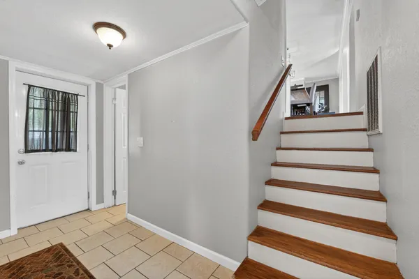 a view of entryway with stairs