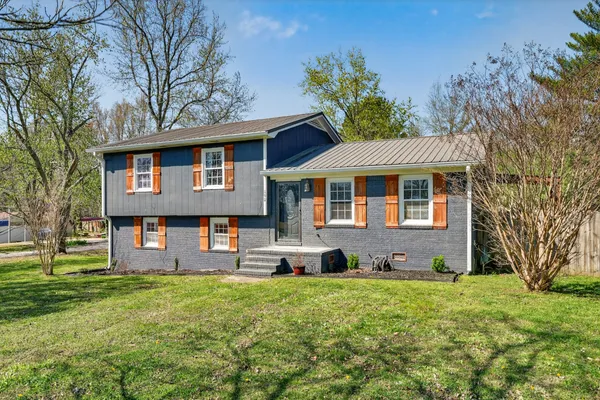 a front view of a house with a yard