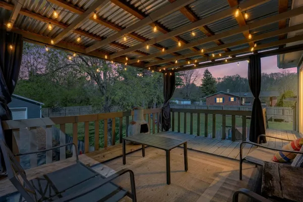 a view of a chairs and table in the patio