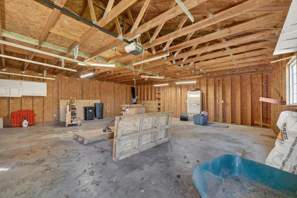 a view of a room with wooden ceiling