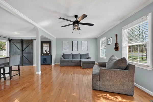 a living room with furniture and a large window