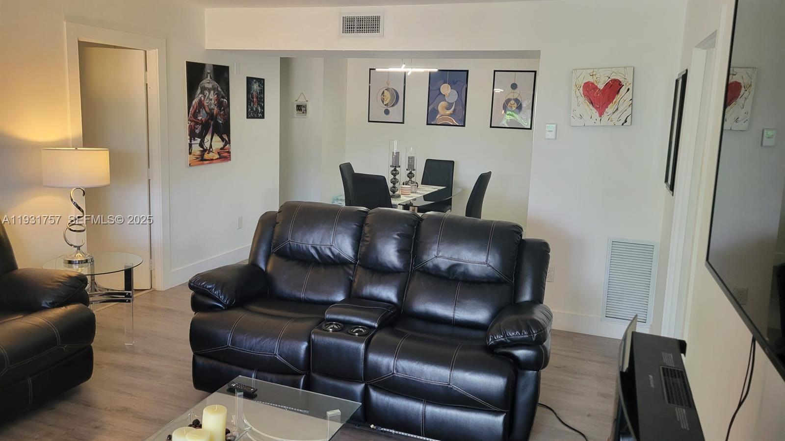 4158 Inverrary Drive, Unit 409 Lauderhill, FL 33319 - Photo 11 of 23 a living room with furniture