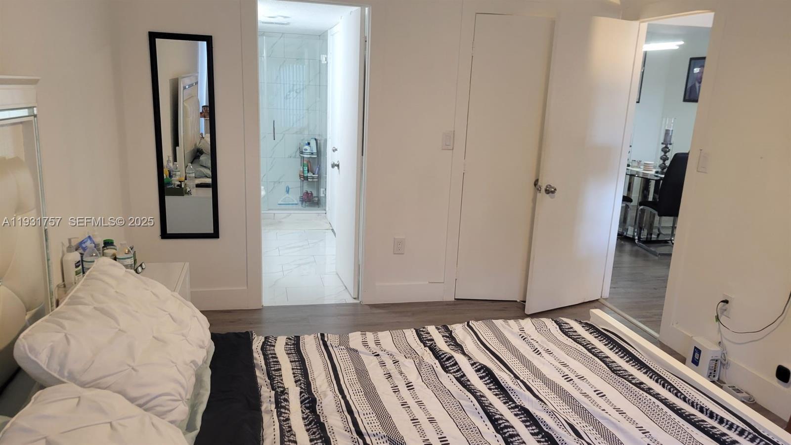 4158 Inverrary Drive, Unit 409 Lauderhill, FL 33319 - Photo 15 of 23 a view of a hallway with wooden floor and stairs