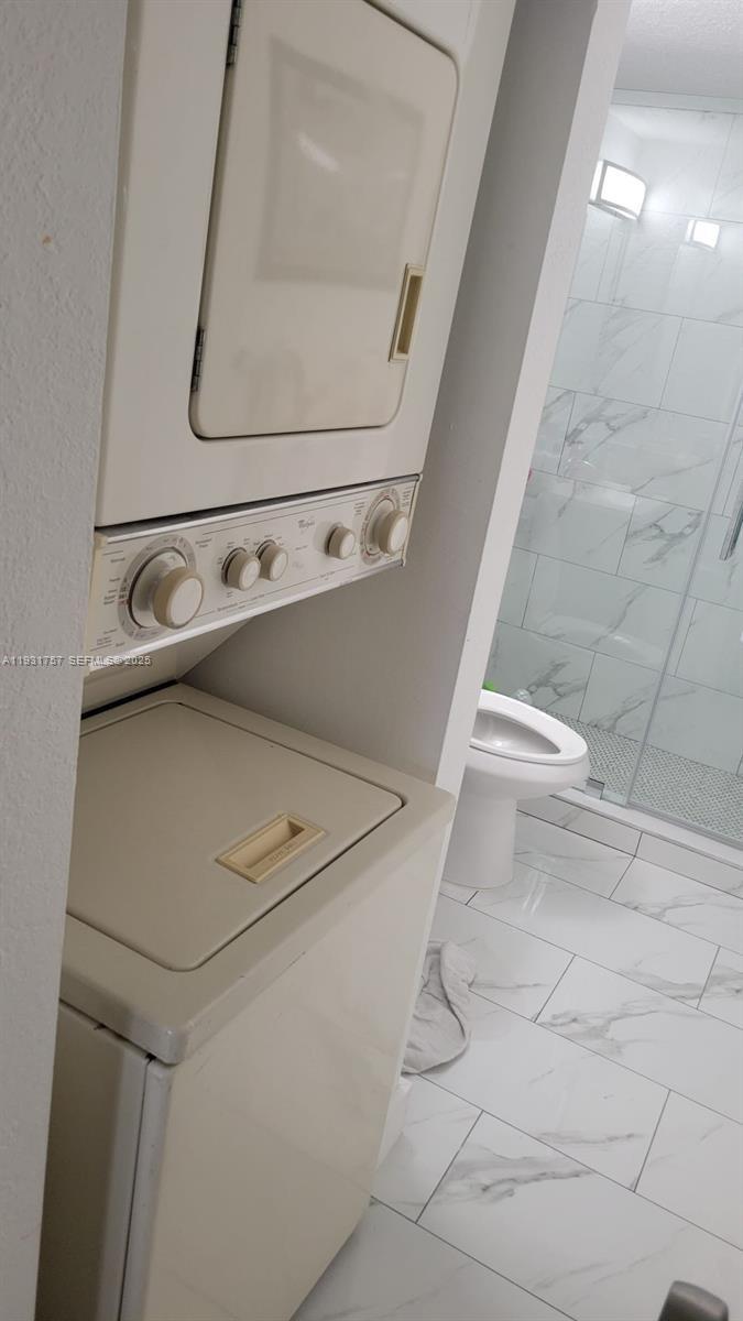 4158 Inverrary Drive, Unit 409 Lauderhill, FL 33319 - Photo 19 of 23 a utility room with dryer and washer