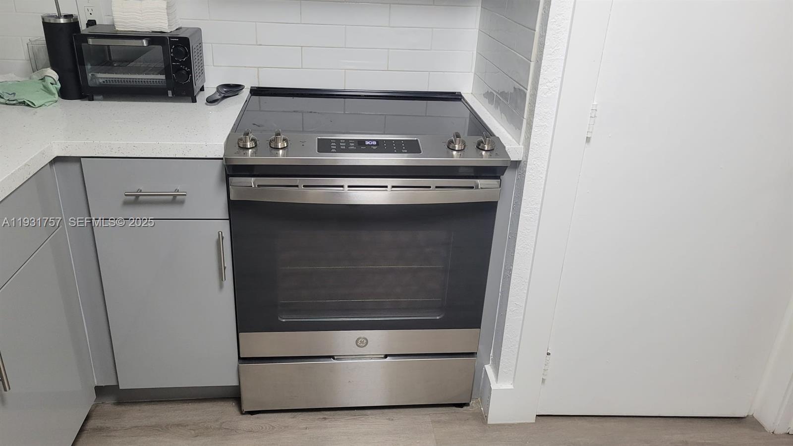 4158 Inverrary Drive, Unit 409 Lauderhill, FL 33319 - Photo 6 of 23 a stove top oven sitting inside of a kitchen