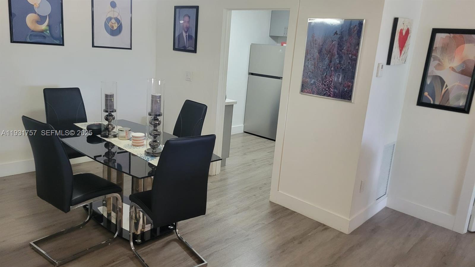 4158 Inverrary Drive, Unit 409 Lauderhill, FL 33319 - Photo 8 of 23 a view of a workspace with furniture and wooden floor