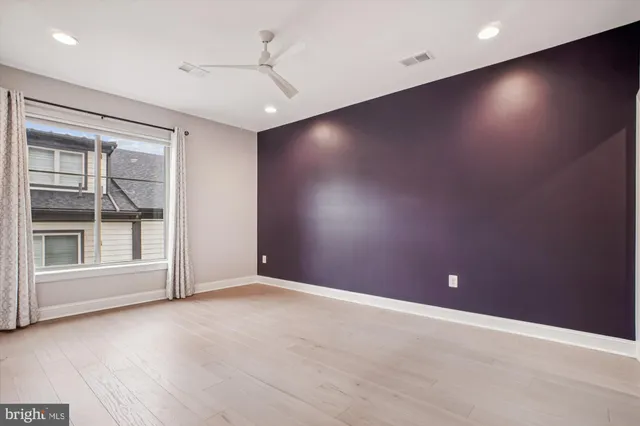 an empty room with windows and entrance