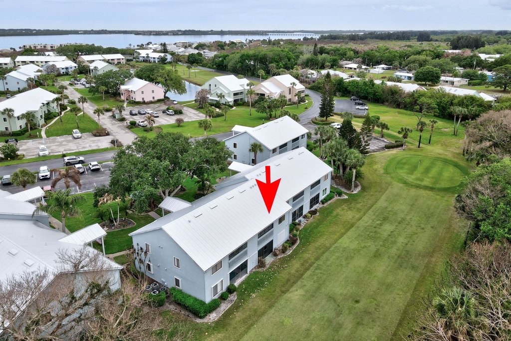 9637 Riverside Drive, Unit 3 Sebastian, FL 32958 - Photo 28 of 36 an aerial view of a house with a yard