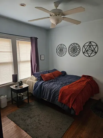 a bedroom with a bed and a table