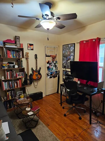 a room with gym equipment and a flat screen tv