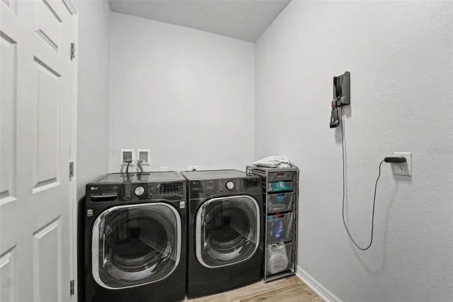 a utility room with dryer and washer