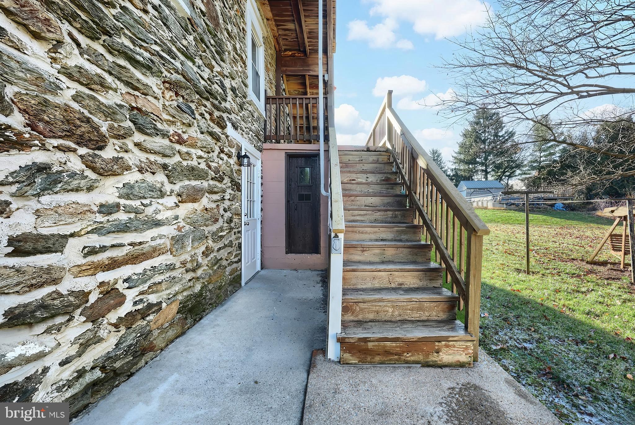 9446 East Springfield Road Seven Valleys, PA 17360 - Photo 41 of 53 Side entrance to basement & stairs to unit 1 deck