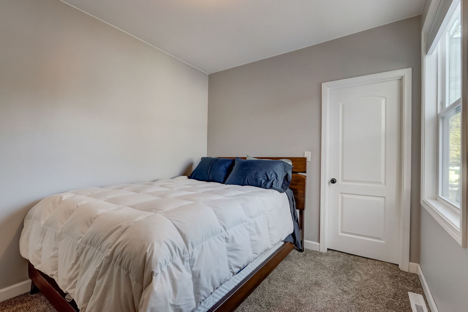 35671 North Wilson Road Ingleside, IL 60041 - Photo 22 of 52 a large bed sitting in a bedroom next to a window