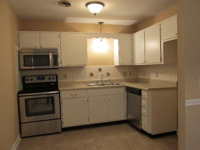 113 Hicks Road, Unit 113 Nashville, TN 37221 - Photo 7 of 20 Kitchen has new appliances and new countertop along with new lighting.