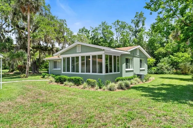 a view of a house with a yard