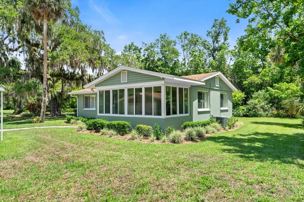 1020 Old Big Tree Road Daytona Beach, FL 32119 - Photo 26 of 37 a view of a house with a yard
