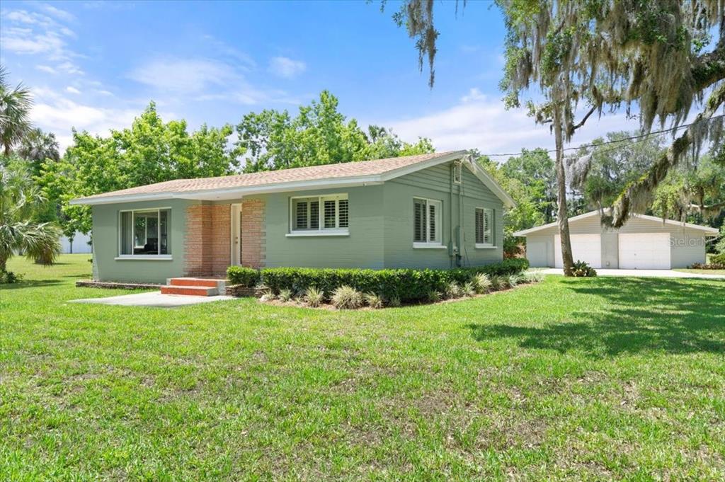 1020 Old Big Tree Road Daytona Beach, FL 32119 - Photo 3 of 37 a front view of house with yard and green space