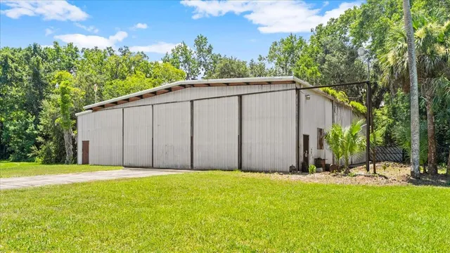 a view of a back yard with a small cabin