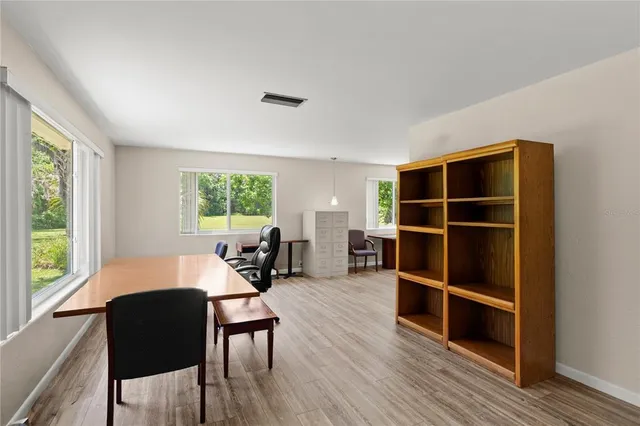 a living room with furniture window and wooden floor
