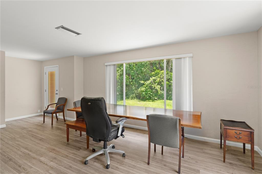 1020 Old Big Tree Road Daytona Beach, FL 32119 - Photo 6 of 37 a view of a workspace with furniture and a window