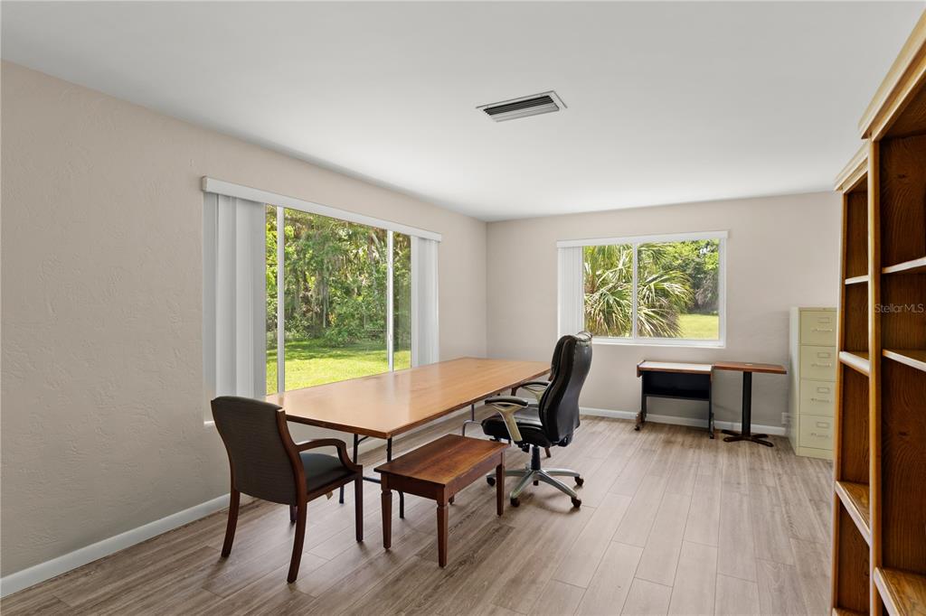 1020 Old Big Tree Road Daytona Beach, FL 32119 - Photo 7 of 37 a view of a workspace with furniture and a window