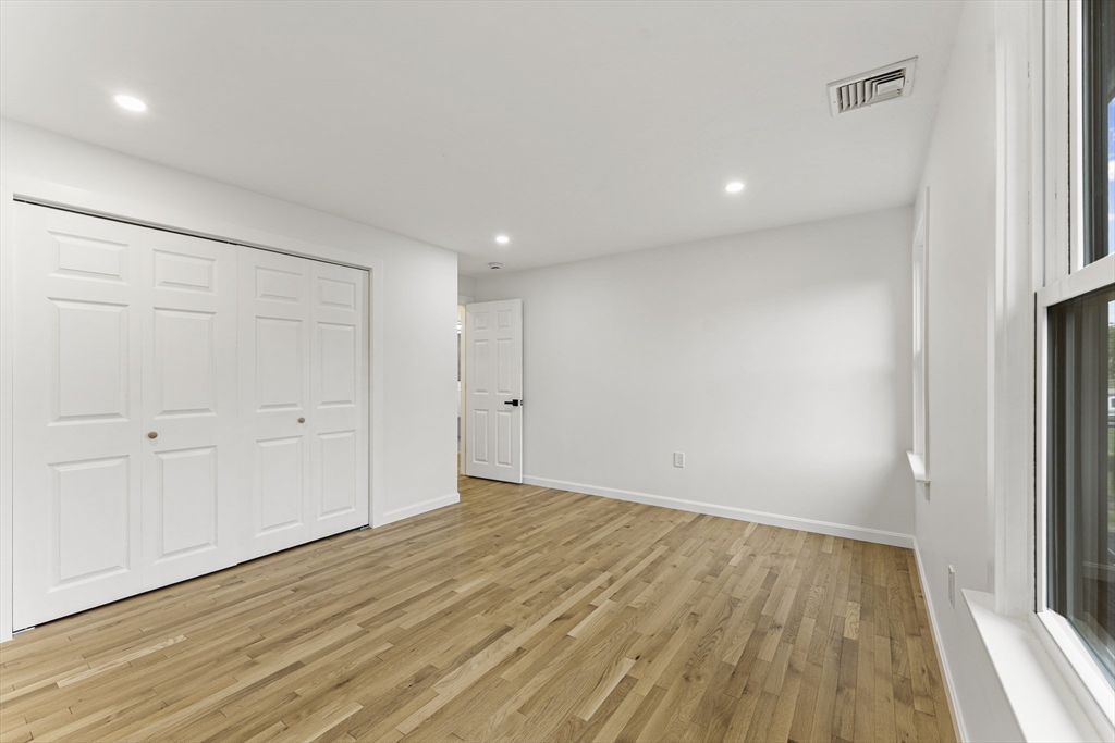 3 Stetson Circle Walpole, MA 02081 - Photo 23 of 42 wooden floor in an empty room with a window