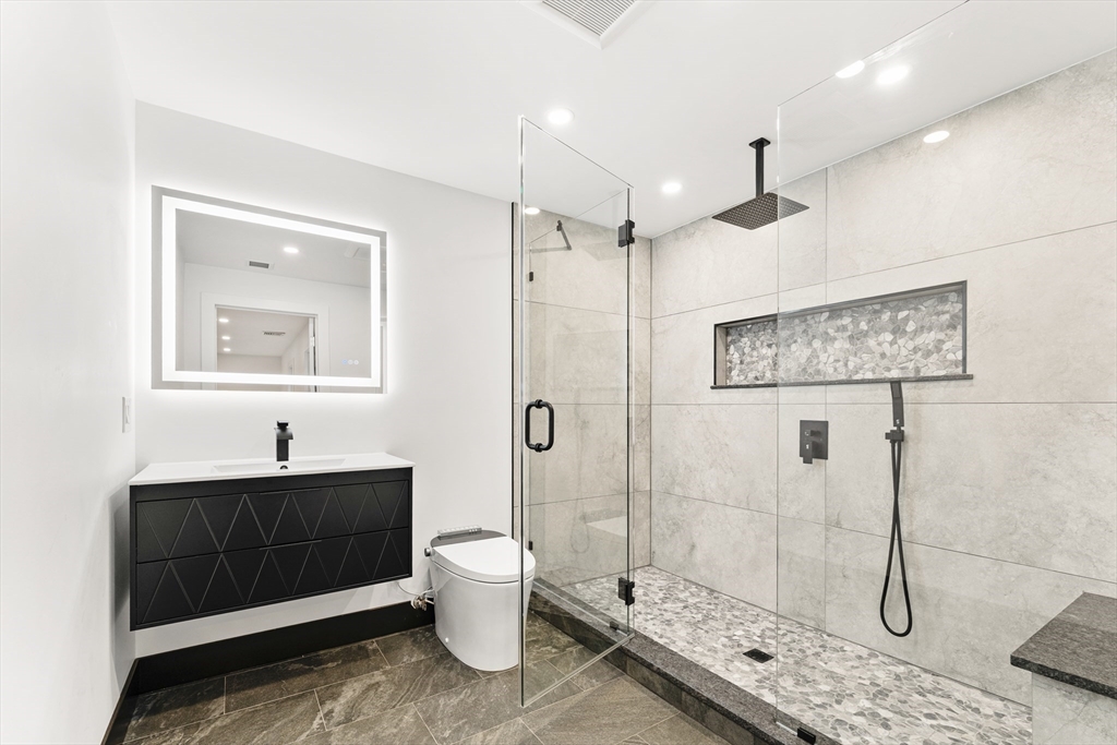 3 Stetson Circle Walpole, MA 02081 - Photo 27 of 42 a bathroom with a sink a toilet and shower