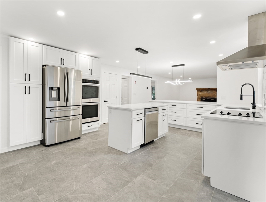 3 Stetson Circle Walpole, MA 02081 - Photo 3 of 42 a kitchen with stainless steel appliances a refrigerator sink and cabinets