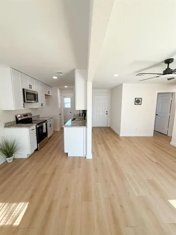 a view of house with a yard