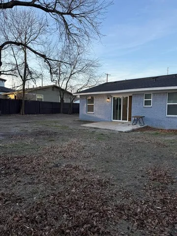 a view of a backyard of the house