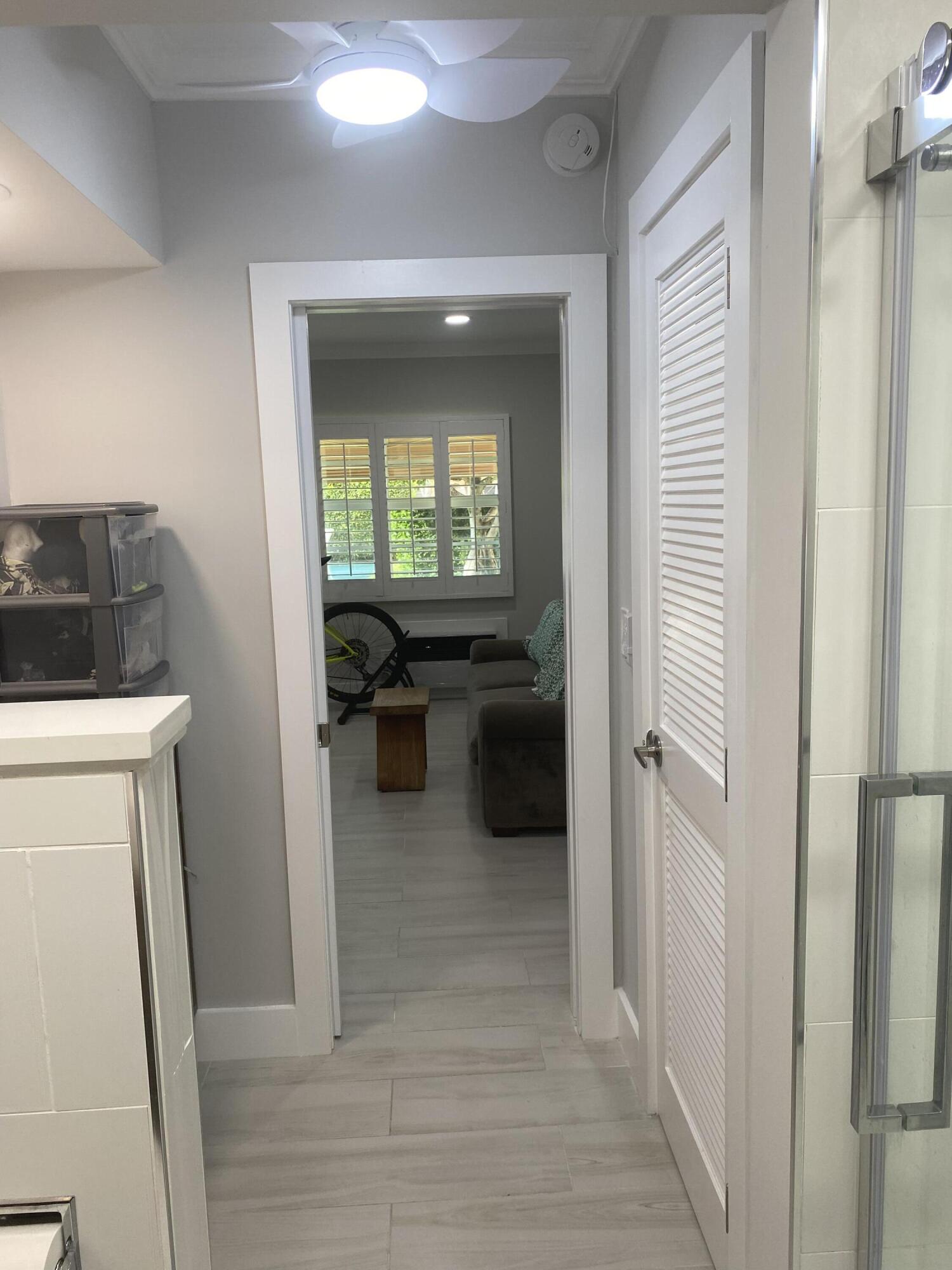 31 South Golfview Road, Unit 5 Lake Worth Beach, FL 33460 - Photo 9 of 11 a view of a hallway and a livingroom with furniture