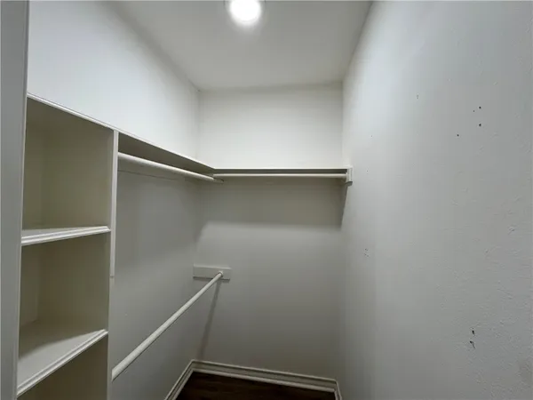 a view of an empty walk in closet